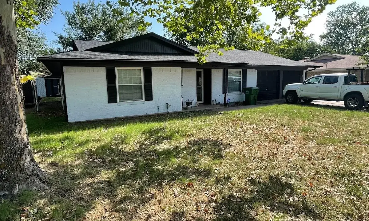 Professional roofing crew working on a residential roof in Cambridge